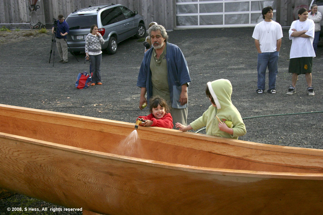 Kids participating in wetting the canoe